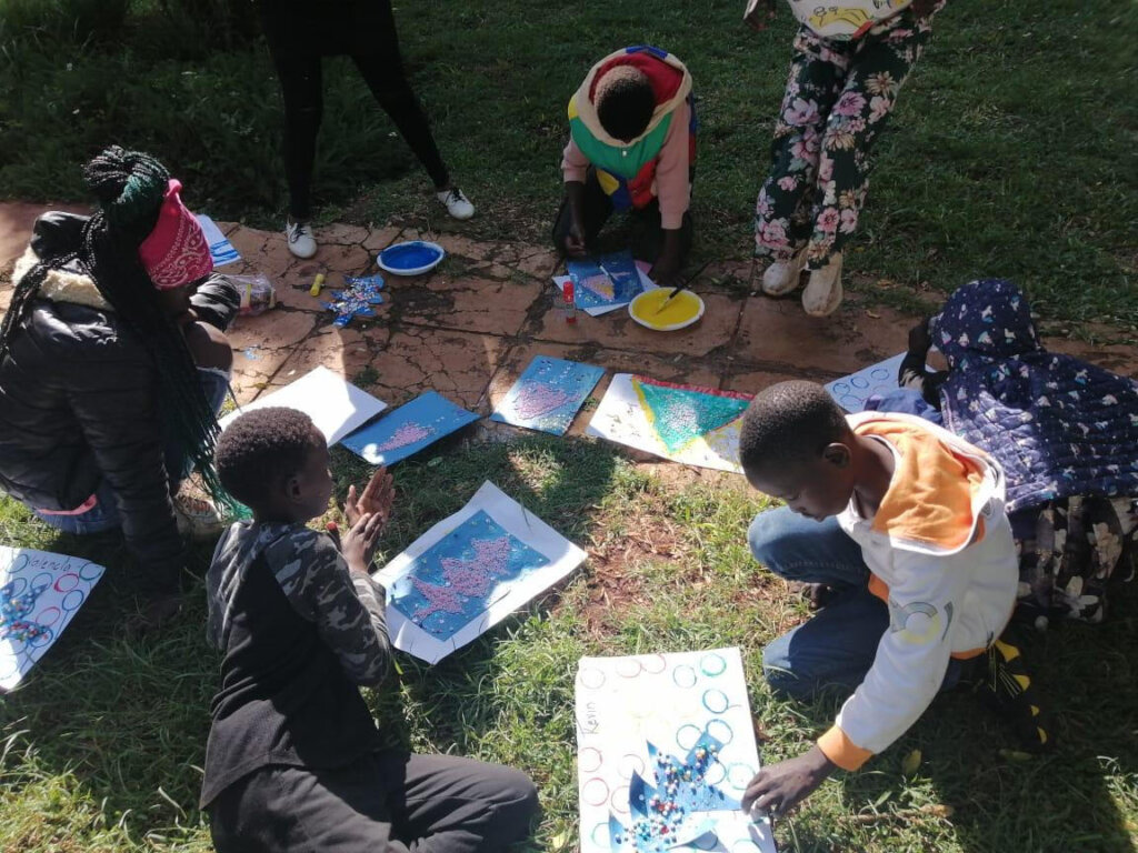 Children participating in play and art therapy