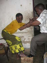 Charles and one of UKUN's patients