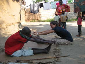 Volunteer Emily working with patient