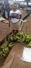 Eseh sells plantain in Ekondo-Titi market