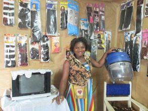 Beneficiary advancing in her hair dressing busines