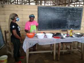 resource person giving lessons on puff-puff making