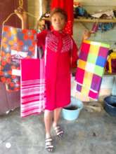 Milvert displaying some of the fabrics she bought