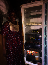 Mamisala showing th content of her fridge