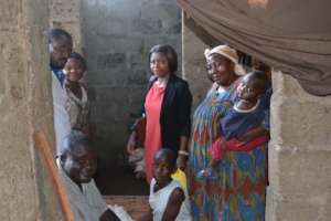 Marie's family with our team and disbursed pigs