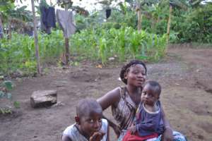 Marie & son. Farming waste will help feed the pigs