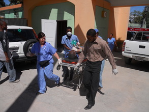 EMT's transporting critical patient (Medishare)