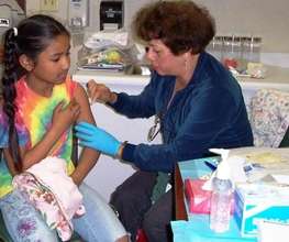 Student Receiving an H1N1 Vaccination in a SBHC
