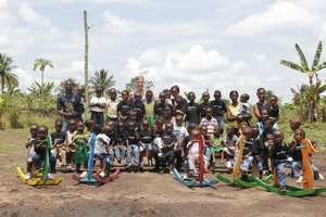 Kelly with the children of the day-care