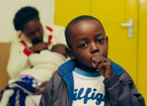 child and baby with Sickle Cell Disease at clinic
