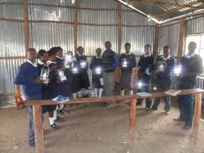 Some of the students pose with their new lamps