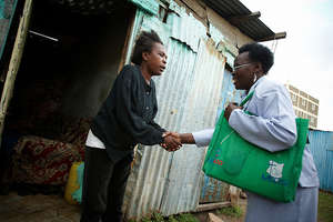 Kenya Urban Slums CHW visiting client