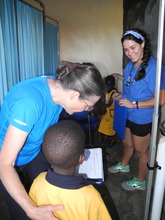 Karen Hinckley helps with children's physicals.