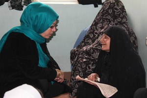 A teacher and an elderly student at a Center