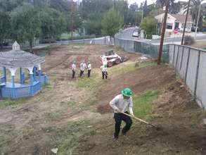 Corpsmembers clear out weeds