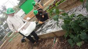 Corpsmembers working on our new garden beds