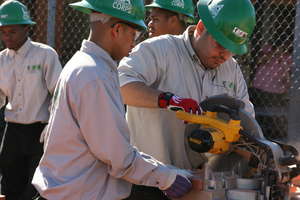 Corpsmembers build raised garden beds