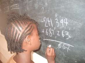 A Child Writting on the Board