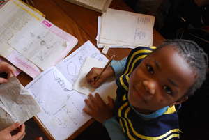 Nursery two pupil in class studying