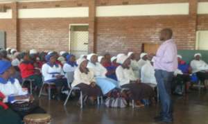 Trinity staff lead a sensitisation meeting