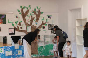 1. Jamie Cowan with students at art celebration