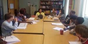 LAYC students at work with artist Regie Cabico