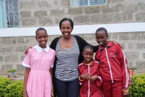 Lucy, MGEF Kajiado Director, with New Students