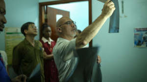 Dr. Paonessa examining patient xray