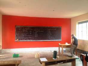 Painting Primary 6 Orange in the Rainbow School