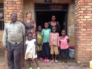 Olive and family with MCF Peace Corps Volunteer