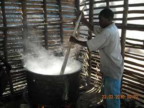 The Cook at Rushakyi Prepares Porridge