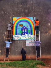 The Rainbow School System sign that we made