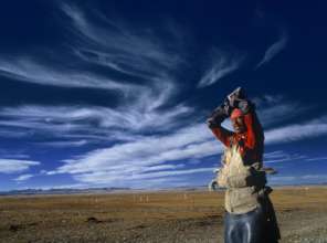 A Tibetan man doing prostrations in Amdo.