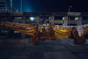 Buddhist monks meditating and praying