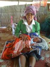Midwife looks after a newborn baby at Prey Vihea