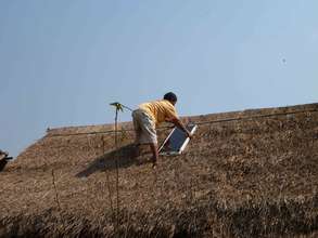 Installing a solar panel on top of a thatched roof