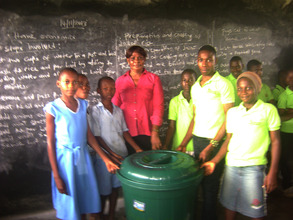 MIND kids from Aluu donated wastebins to schools