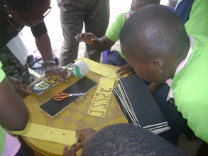 MINDkids in Rumukwurushi working on their signpost
