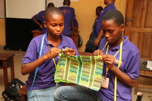MIND kids working on thier bag sewing project