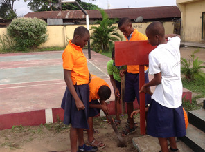 MIND kids from Amadi-Ama working on their signpost
