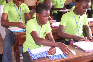 MIND kids working on their ankara notebook project