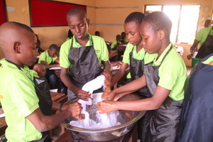MIND kids working on their tie and dye project