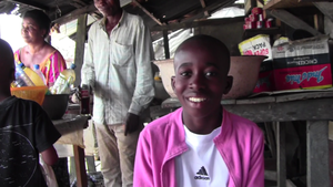 Emeka Bello at his mother's shop