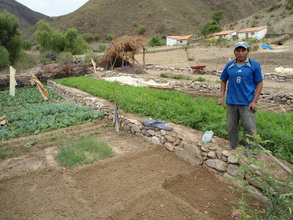 Young man working in his family garden in Tarabuco