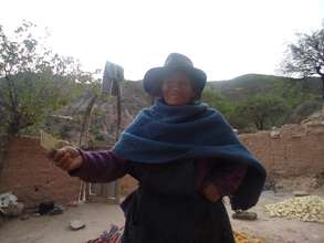 Older woman showing earnings from produce sale