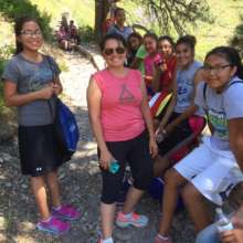 Young women  resting on way to top of Bear Butte