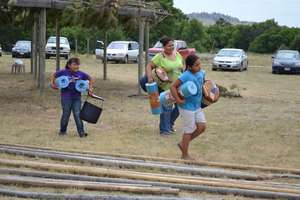 Assigning sleeping bags and mats to the children