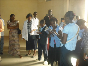 Students taking notes...