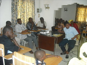 Audience watching the presentation...