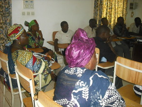 Audience watching the presentation...